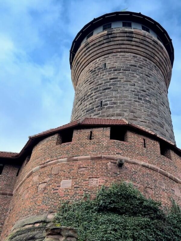 Looking almost straight up, the Sinwell tower is made of brick and stretches up to the sky, perfectly circular