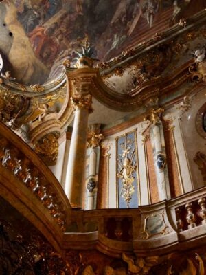 Light falls through a large window to illuminate the heavenly riches of the Asamkirche, gilt edges line the white and rose gold marble while frescoes adorn the roof of the chapel, gold and colour are on every surface.