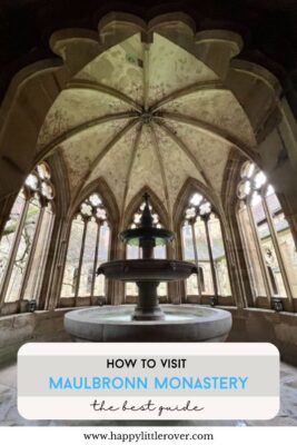 A large symmetrical fountain is shown within a fountain house with three round tiers and large, ornate, arched windows. The text reads how to visit Maulbronn Monastery the best guide