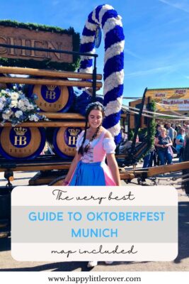 A large wagon is shown with dark wooden barrels, emblazoned with a golden HB insignia, a lady wears a blue and pink dirndl with her hair in plaits. The text reads the very best guide to Oktoberfest Munich map included.