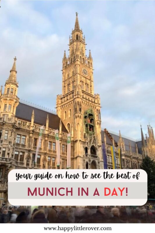 A large building with many spires is lit up golden from late afternoon sun and crowds mill underneath it. The text on the image reads your guide on how to see the best of Munich in a day
